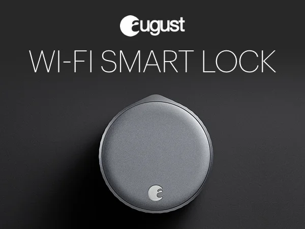 August Wi-Fi Smart Lock (4th Gen) attached to a deadbolt, displaying its sleek, dark grey finish
