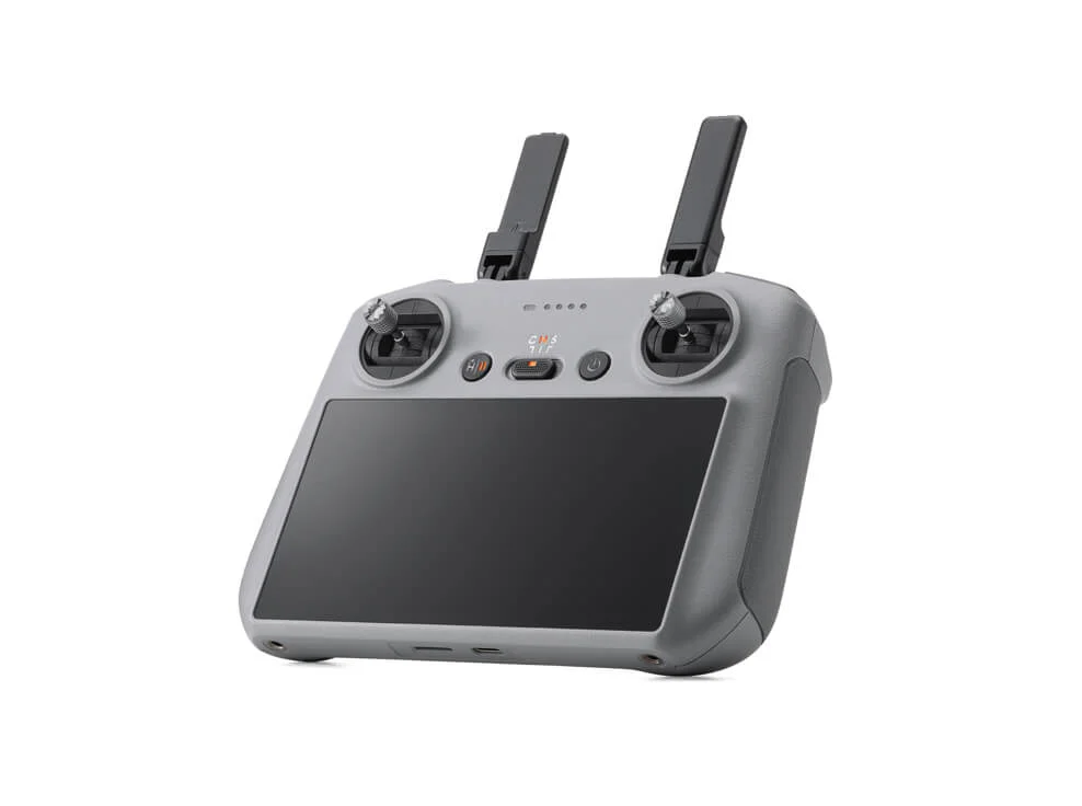 A compact DJI Mini 4 Pro drone hovering against a blue sky, showcasing its foldable design and advanced camera with omnidirectional obstacle sensing for professional aerial photography and videography.