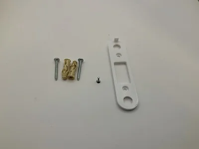 Google Nest Doorbell (Wired, 2nd Gen) with a minimalist white design, mounted flush against a dark wall, highlighting its camera lens and button.